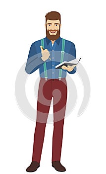Hipster with pen and pocketbook photo
