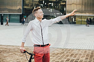 Hipster with red bycicle and tattoo on leg