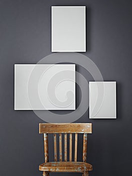 Hipster's composition, posters, chair on gray wall,