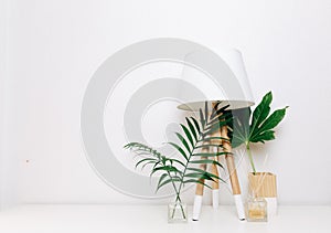 Hipster Scandinavian style room interior. Nordic lamp with tropical leaves.