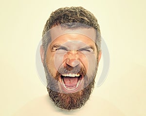 Hipster with scared face screaming. Feeling and emotions. Man with long beard and mustache.