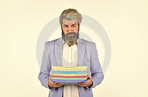 Hipster stylish creative director. Printing documents. Man carry many colorful handouts. Presentation concept. Marketing photo