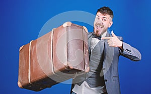 Hipster traveler with baggage. Baggage insurance. Man well groomed bearded hipster with big suitcase. Take all your
