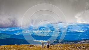 Hipster traveler on top of mountains