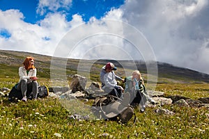 Hipster traveler on top of mountains