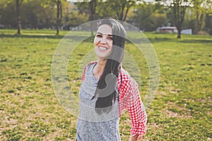 Hipster woman having fun in park