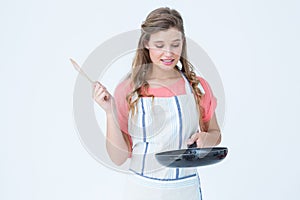Hipster woman holding frying pan