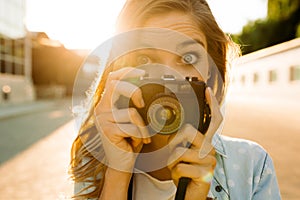 Hipster woman with retro film camera