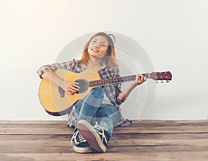 Hipster woman style portrait chillin with guitar look so happy.