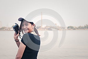 Hipster woman taking photos with retro film camera ,Girl Adventure Hangout Traveling Holiday Photography Concept