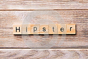 Hipster word written on wood block. Hipster text on wooden table for your desing, concept