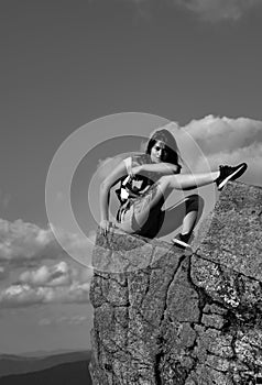 Hipster young girl enjoying sunset on peak mountain. Tourist traveler on background valley landscape view mockup. Go Ape