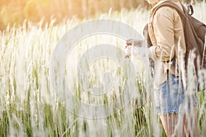 Hipster young girl jump with backpack hiking in forest., relax time and enjoying nature around.