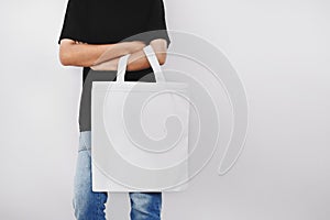 hipter woman holding eco fabric bag isolate on white background