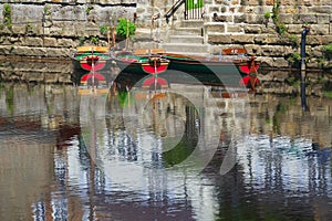Hire boats on river surface with reflections