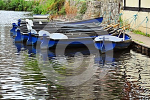 Hire boats on river surface with reflections