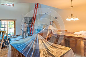 Hired painter painting a home