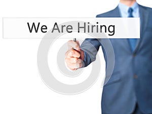 We Are Hiring - Businessman hand holding sign