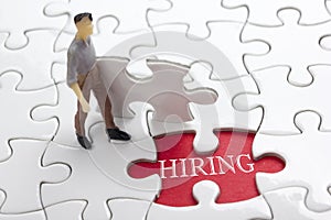 HIRING concept. Missing Piece Jigsaw Puzzle with word