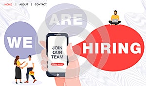 We are hiring concept. Recruitment agency. Hand holding phone with join our team word.