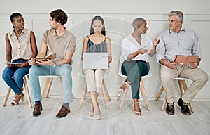 Hiring, recruitment or people in a waiting room for a marketing job interview at a office building. Human resources, men