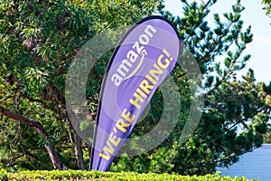 We Are Hiring. Text on feather flag banner advertising hiring by Amazon corporation in Silicon Valley