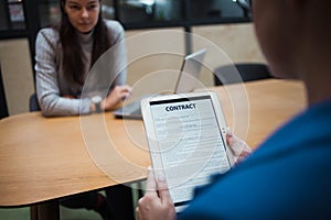 Hiring, you`re hired. The woman holds a tablet in her hand