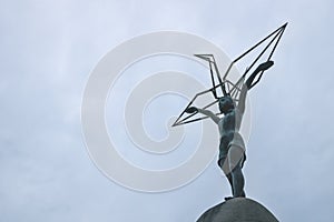 Hiroshima Childrens Peace Monument statue showing a girl with a origami crane on dark sky, Hiroshima, Japan