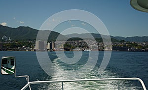 Hiroshima city and Hiroshima bay view from ferry boat crossing the inland sea between Miyajimaguchi Pier and Miyajima island,