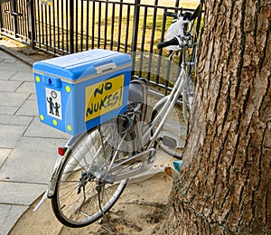 Bicycle in decorated with No Nukes text, antinuclear movement in Hiroshima photo