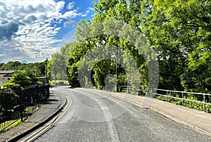 Hirst Lane, with buildings and old trees near, Hirst Wood, Shipley, UK