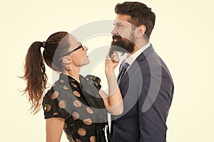 His beard is real. Sensual girl touch hipster beard. Unshaven businessman with long beard hair. Bearded man with stylish