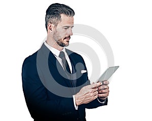 His business dealings demand the smartest technology. Studio shot of a businessman using a digital tablet against a