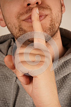 His composed expression enhances the effectiveness of the gesture. The image communicates tranquility and order. With an