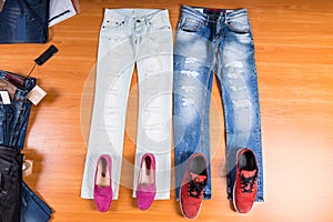 His and Hers Blue Jeans Laid with Shoes