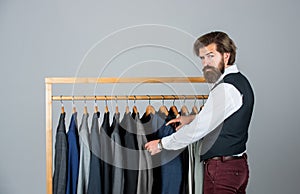 His look is great. Fashion design studio. Male fashion designer. Individual measures hand of man. Man ordering business