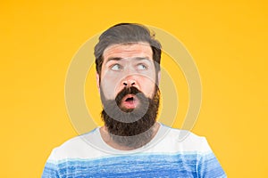 On his mind. Another idea. Have some doubts. Doubtful bearded man on yellow background close up. Doubtful expression