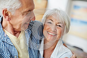 By his side is where Im happiest. Portrait of a loving senior couple at home.