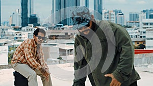 Hispanic break dancer practice B boy dance with friends at roof top. hiphop.