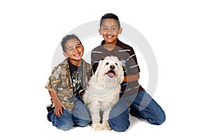 Hispanic Brothers With Their Dog on White
