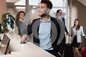 Hispanic Business Man Arrive To Hotel Waiting For Check In Registration Business People Group In Lobby photo