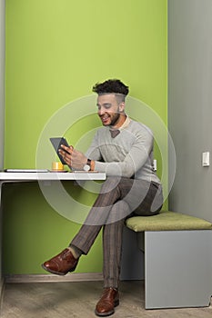 Hispanic Business Man Using Tablet Computer Businessman In Coworking Center Cafe Coffee Break