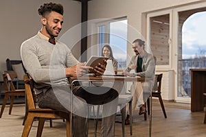 Hispanic Business Man Using Tablet Computer Businesspeople In Coworking Center Cafe Coffee Break