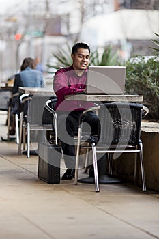 Hispanic Businessman - Telecommuting Internet Cafe