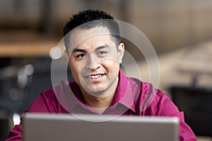 Hispanic Businessman - Telecommuting Internet Cafe photo