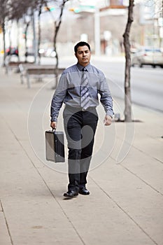 Hispanic Businessman - Walking With Briefcase