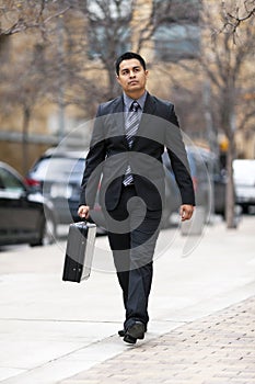 Hispanic Businessman - Walking Downtown