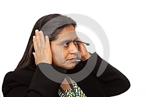 Hispanic Businesswoman Puts On Headset For Call