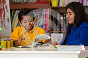 Hispanic Child Learning to Read with Mom photo