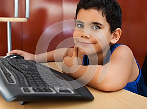 Hispanic child working with a computer